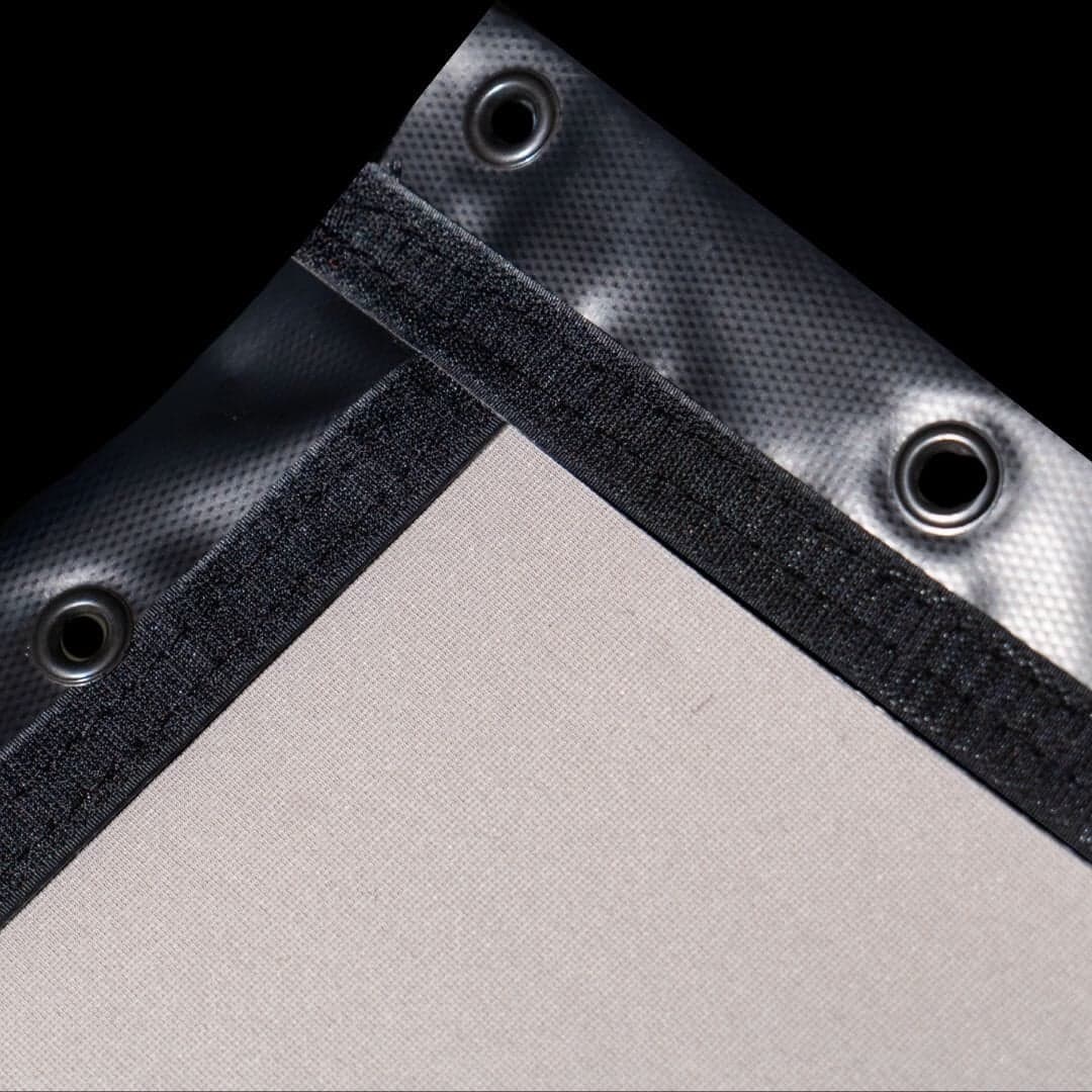 SIGPRO Premier impact screen corner, light screen face with black trim and grommets