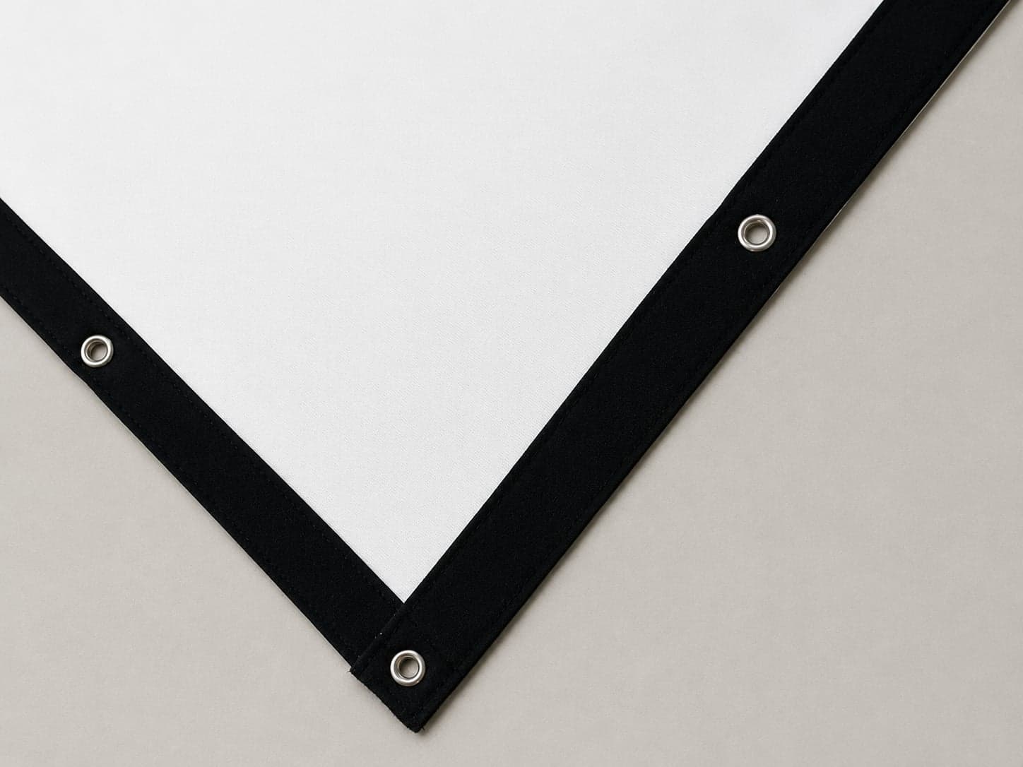 Bullseye premium impact screen corner, white surface with black vinyl trim and grommets